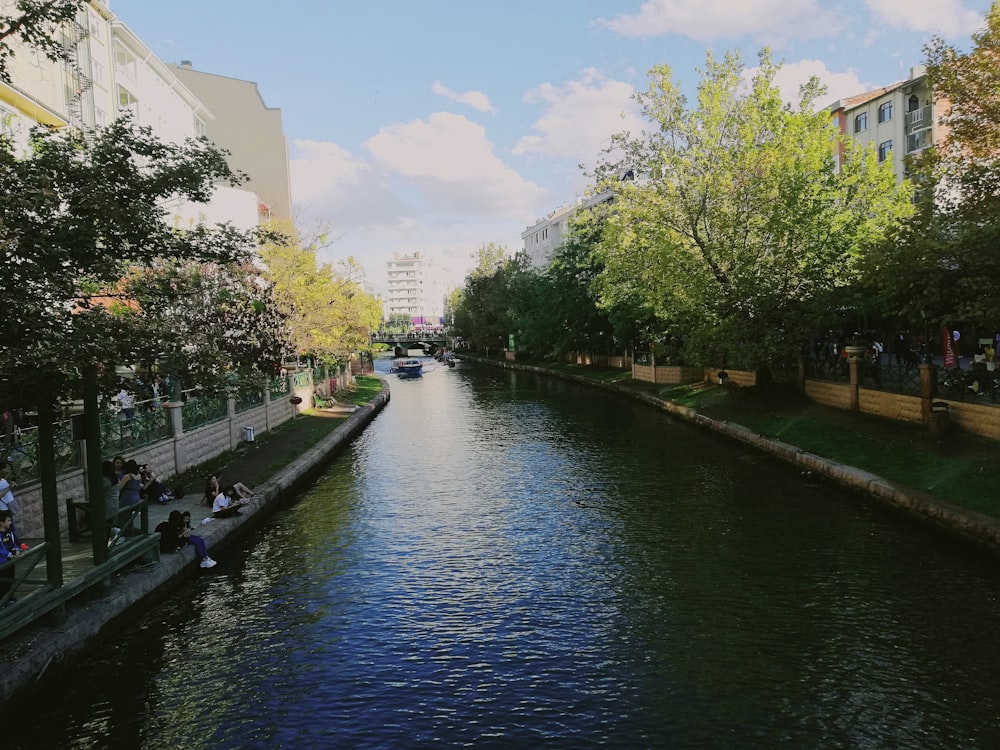 a river running through a city next to tall buildings