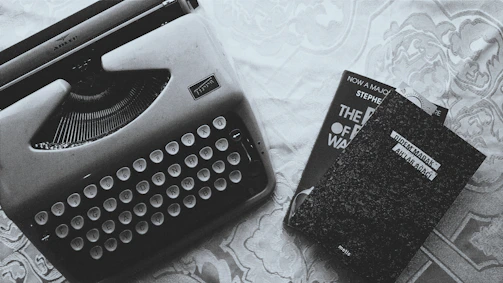 Vintage-style cover of a classic novel with an old typewriter and scattered pages.