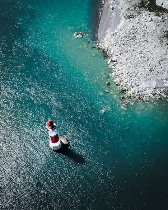 red and white lighthouse in Beachy Head Lighthouse United Kingdom