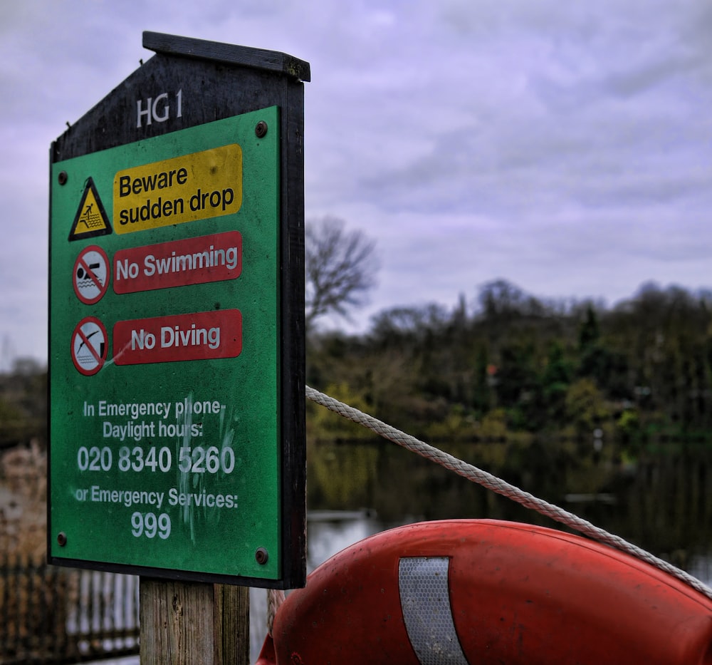beware sudden drop, no swimming, no diving signs