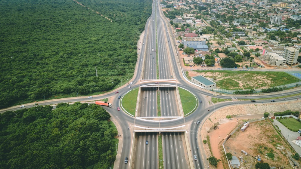 an aerial view of a highway intersection in the middle of a city