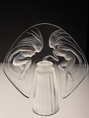 A delicate sculpture of intertwined figures capturing movement and grace.