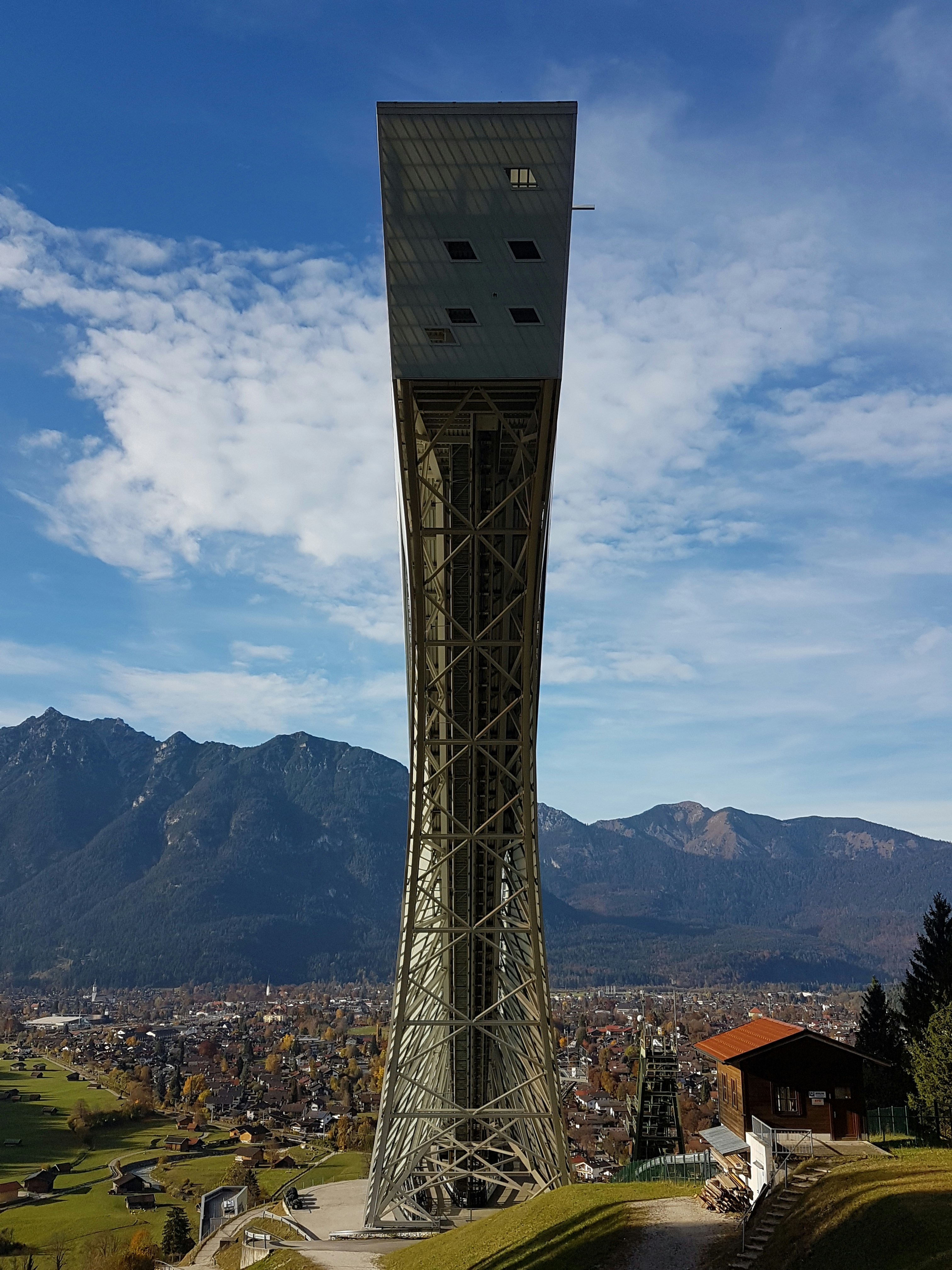 gray concrete building near mountain at daytime