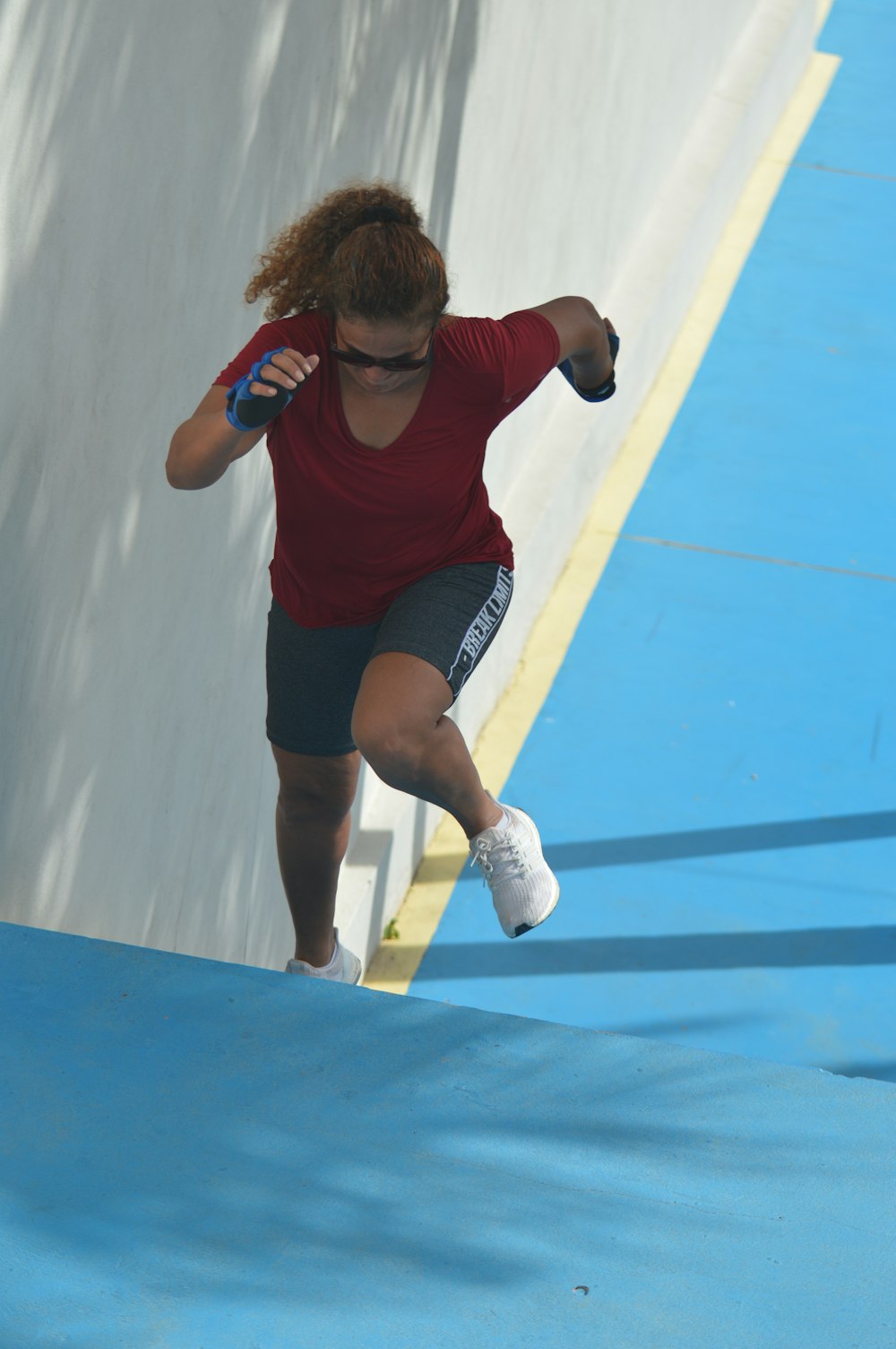 woman running towards hill
