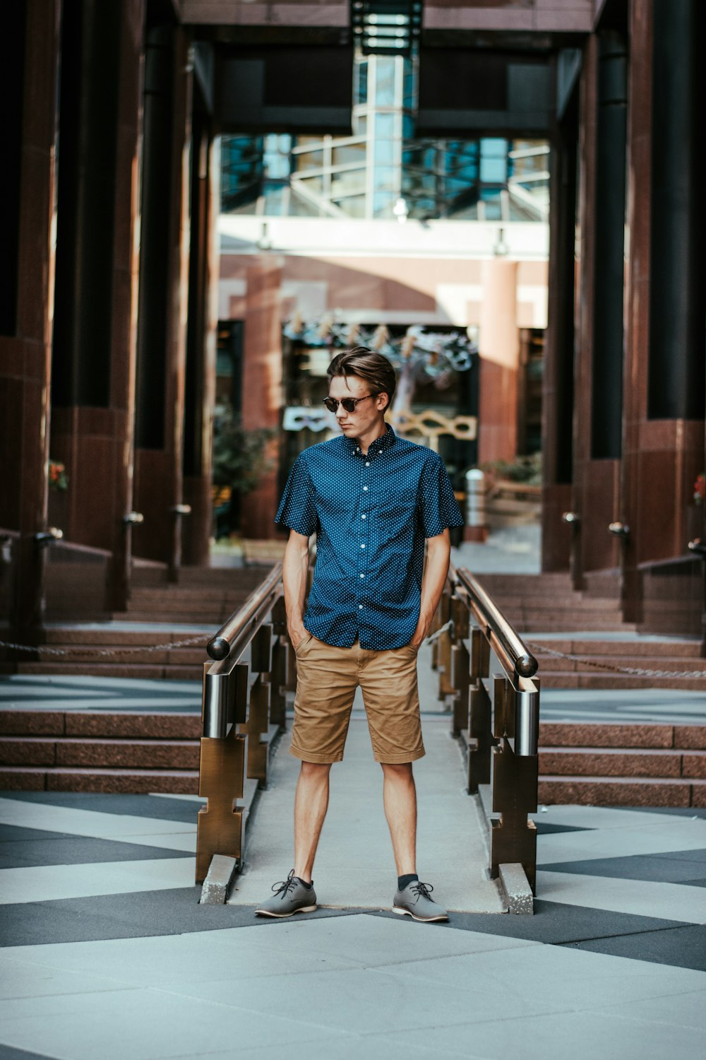 a man standing in front of a set of stairs