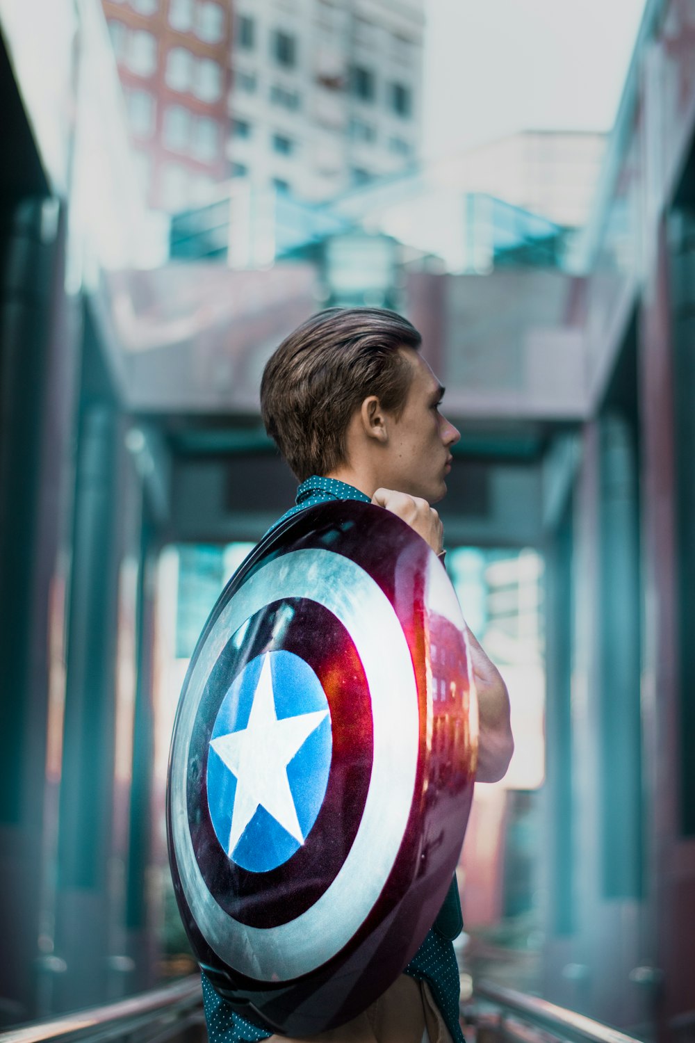 man carrying Captain America's shield