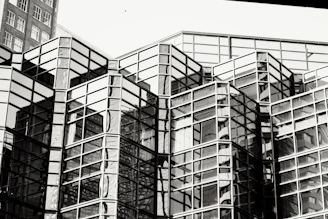 A completed commercial building with reflective glass surfaces.