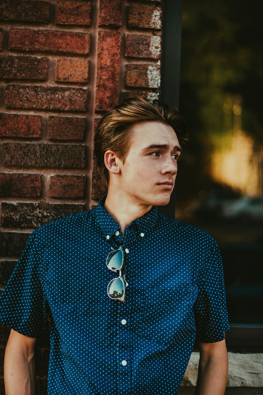 man leaning against wall