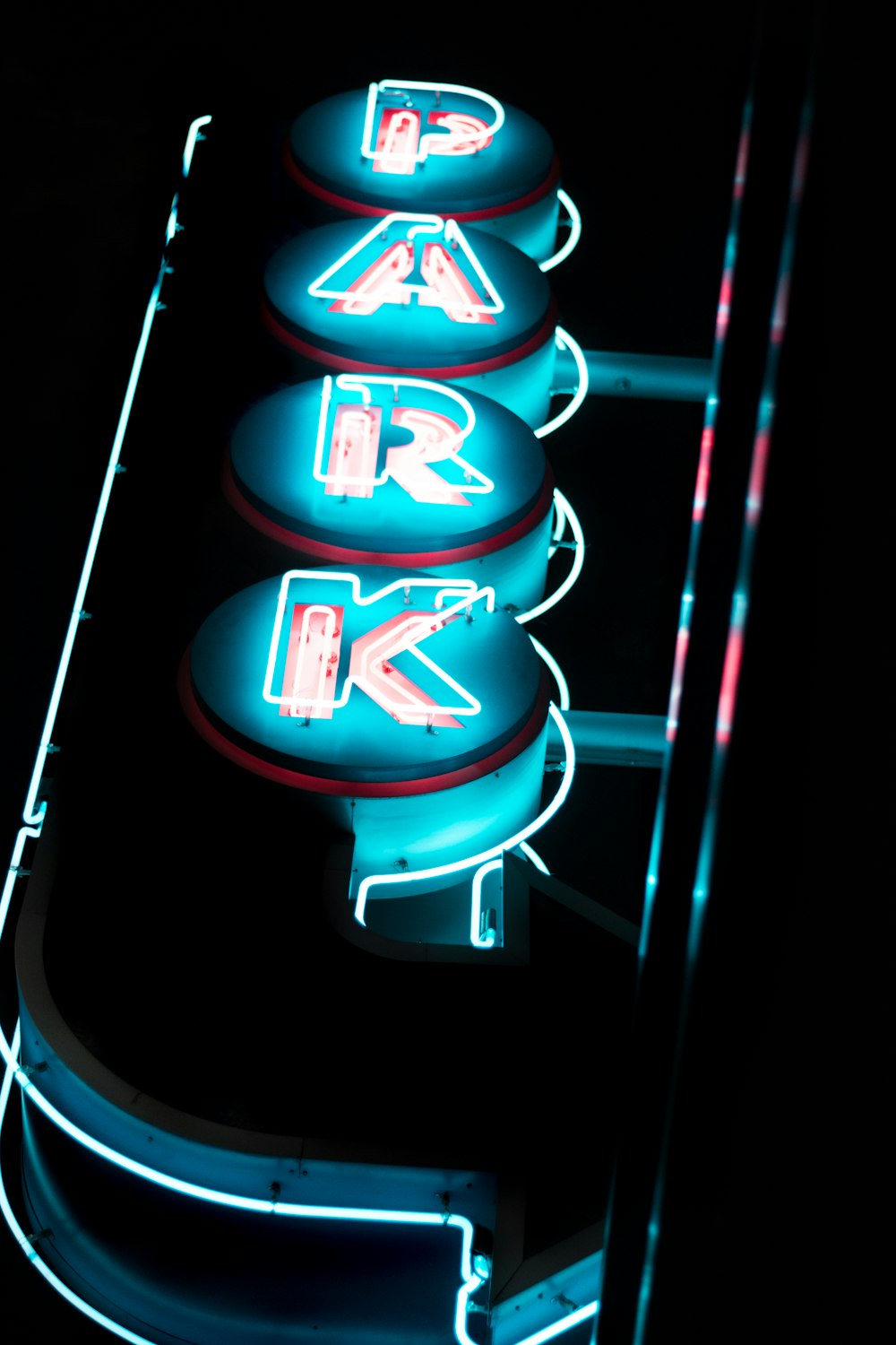 closeup photo of lighted park neon signage