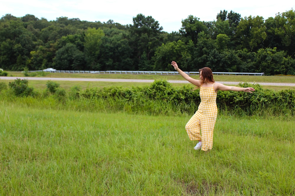 woman wearing yellow jumpsuit