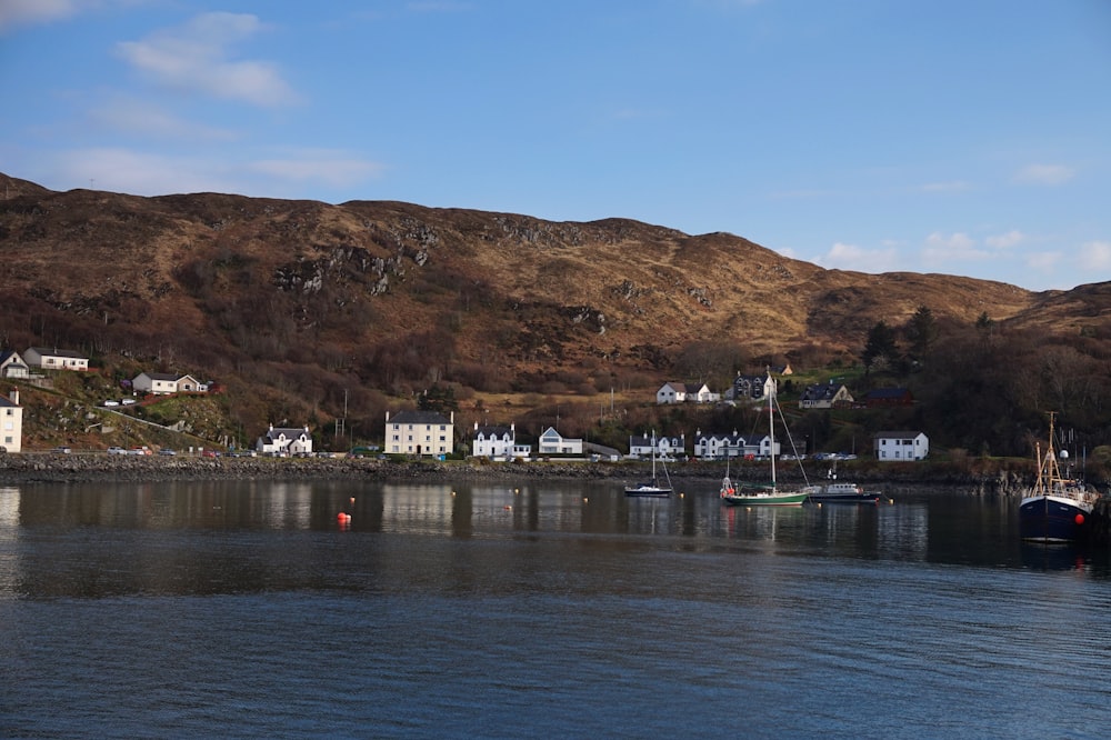 boats on body of water near island with buildings