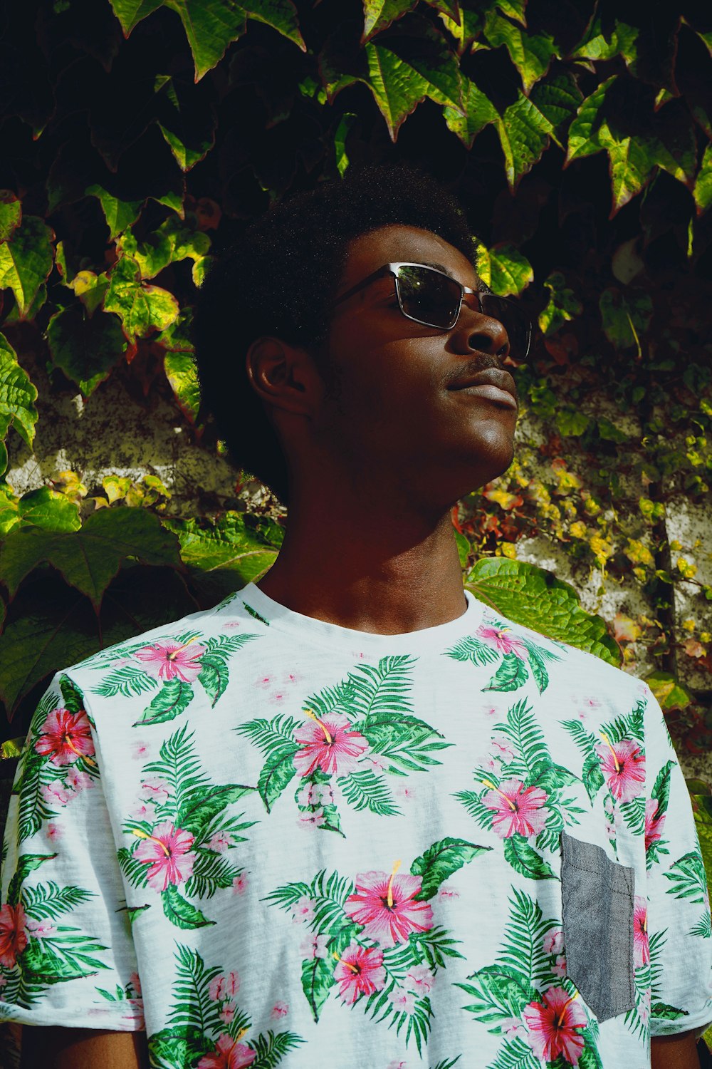 man wearing white floral shirt