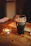 A cozy corner of the bar with warm lighting highlighting a frothy pint of Guinness on a wooden table.