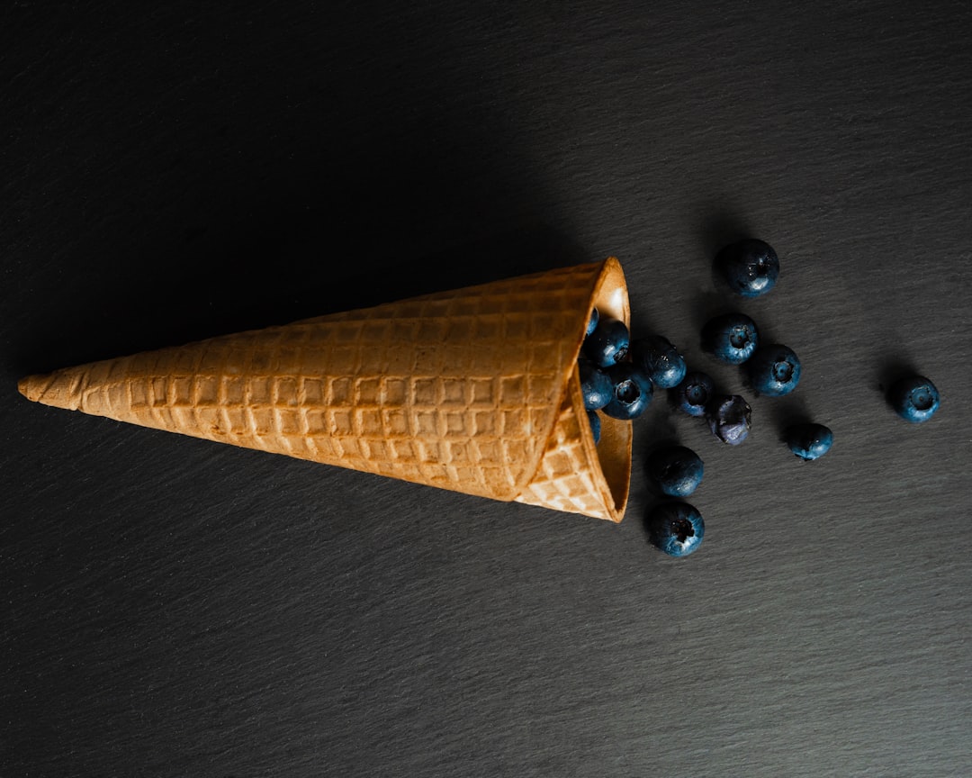brown cone wit berries close-up photography