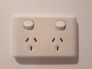 A modern wall switch and socket display.