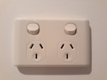 Modern electrical outlets and switches installed in a renovated room.
