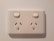 A happy customer showing off their new electrical outlet.