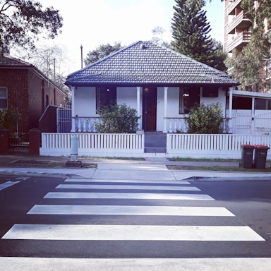 Cozy house with a small garden and white fence