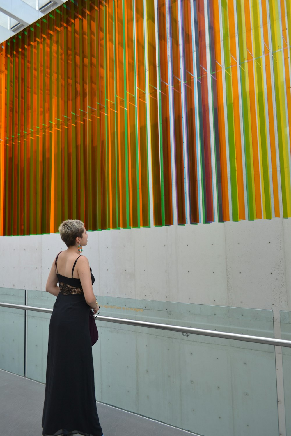 woman wearing black spaghetti strap dress