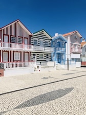 white and red house under blue sky at daytime