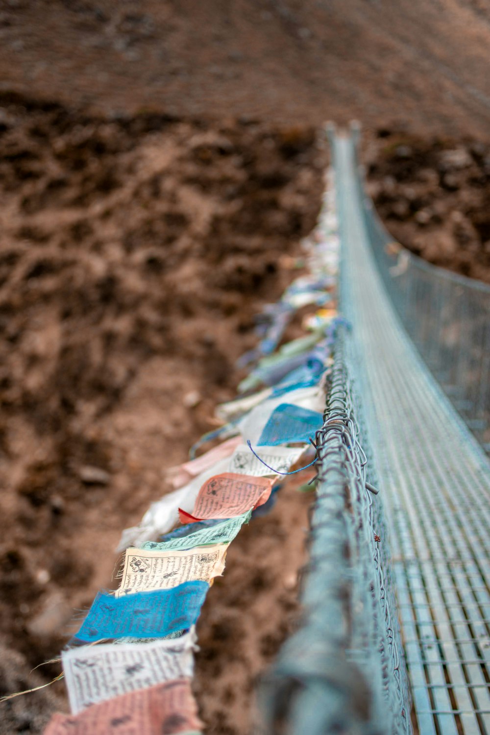 shallow focus photography of gray hanging bridge