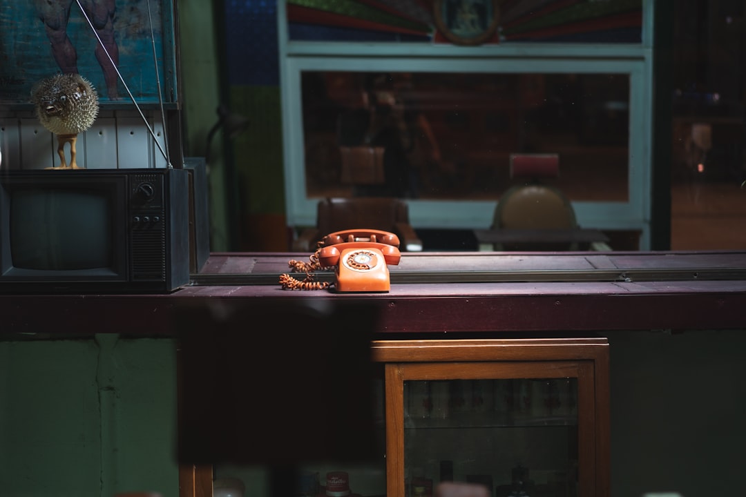 orange rotary telephone