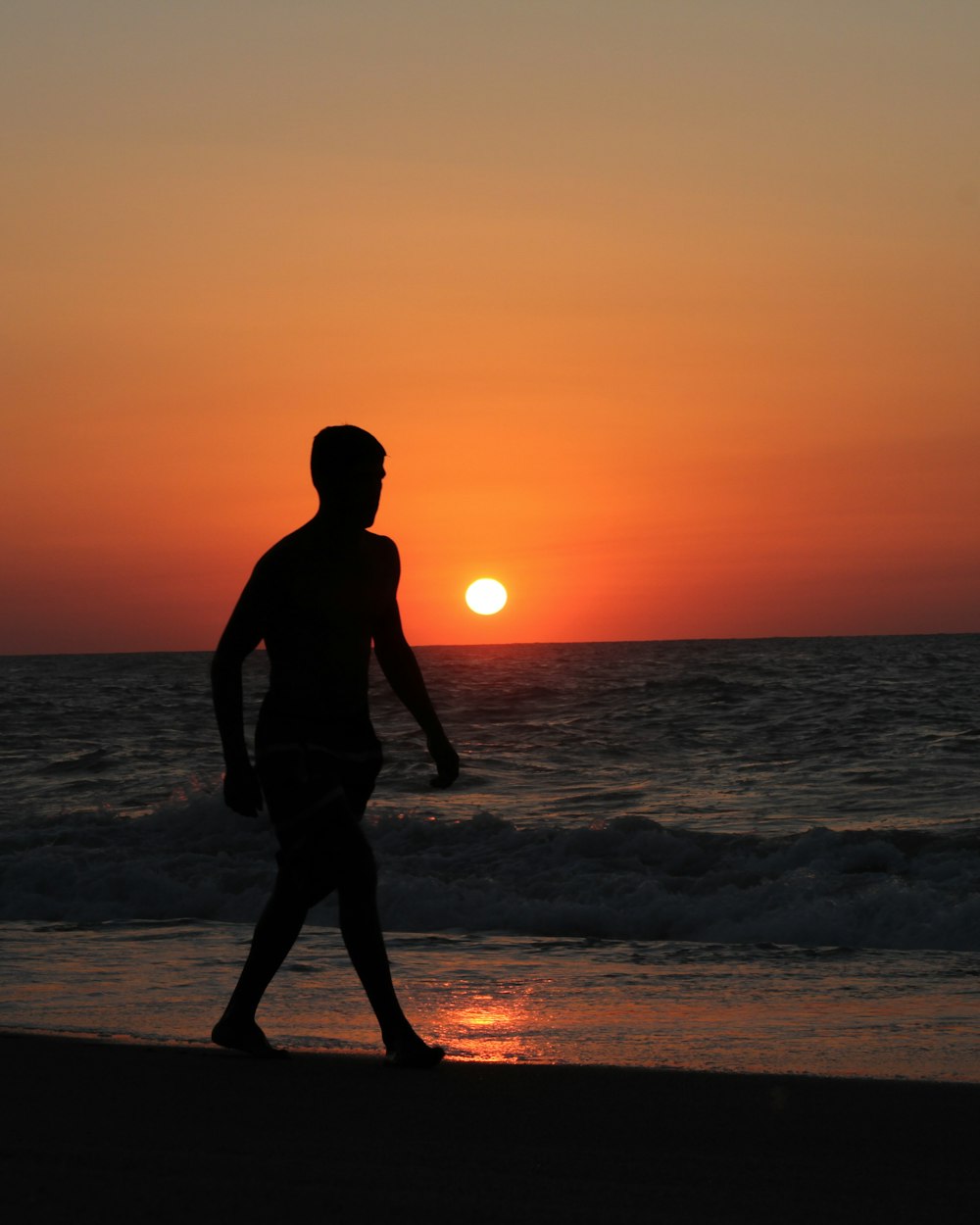 silhouette of man on shore