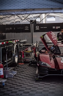 Battery pack and fan unit resting on a garage floor, ready for the next race day.