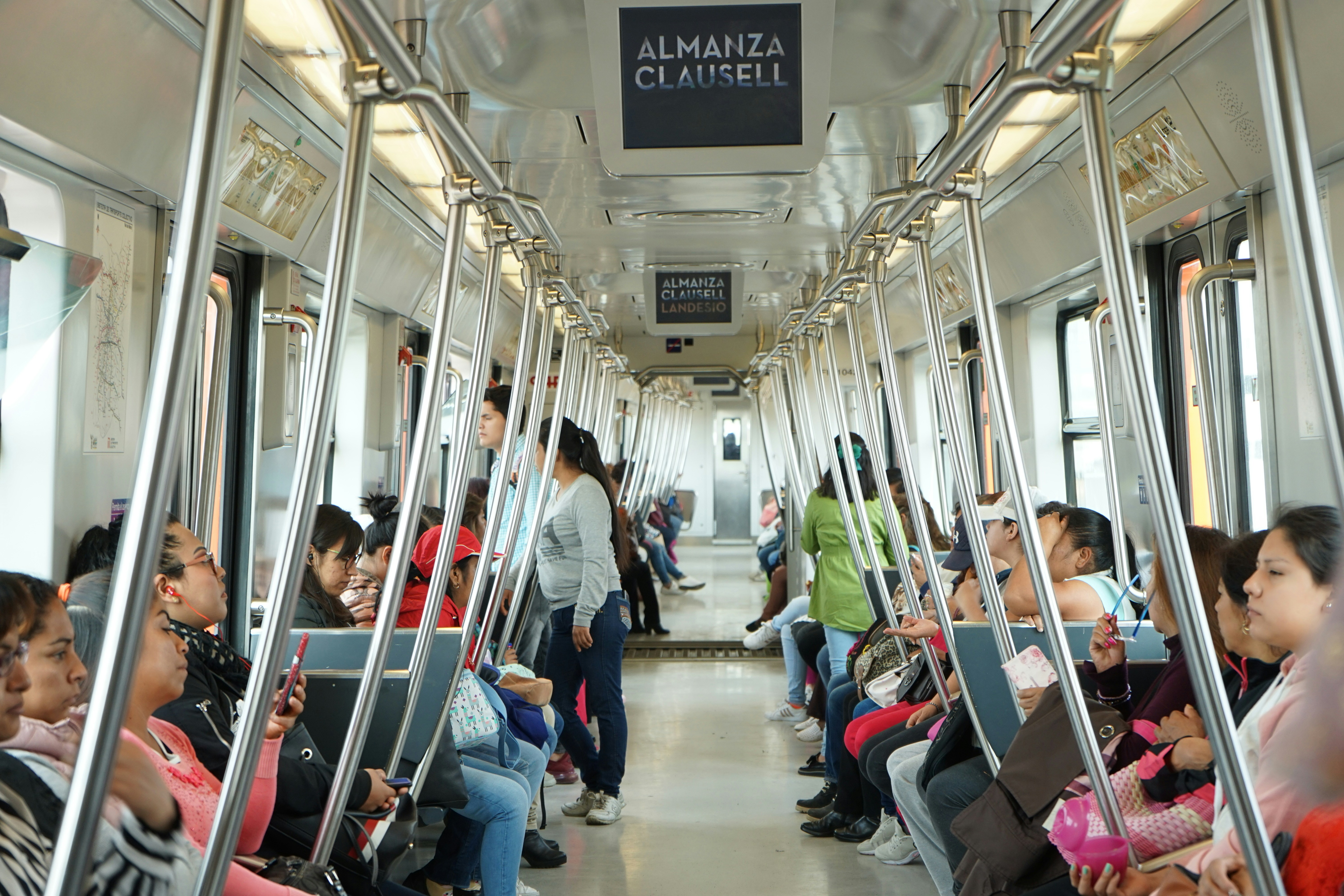 people in a train during daytime