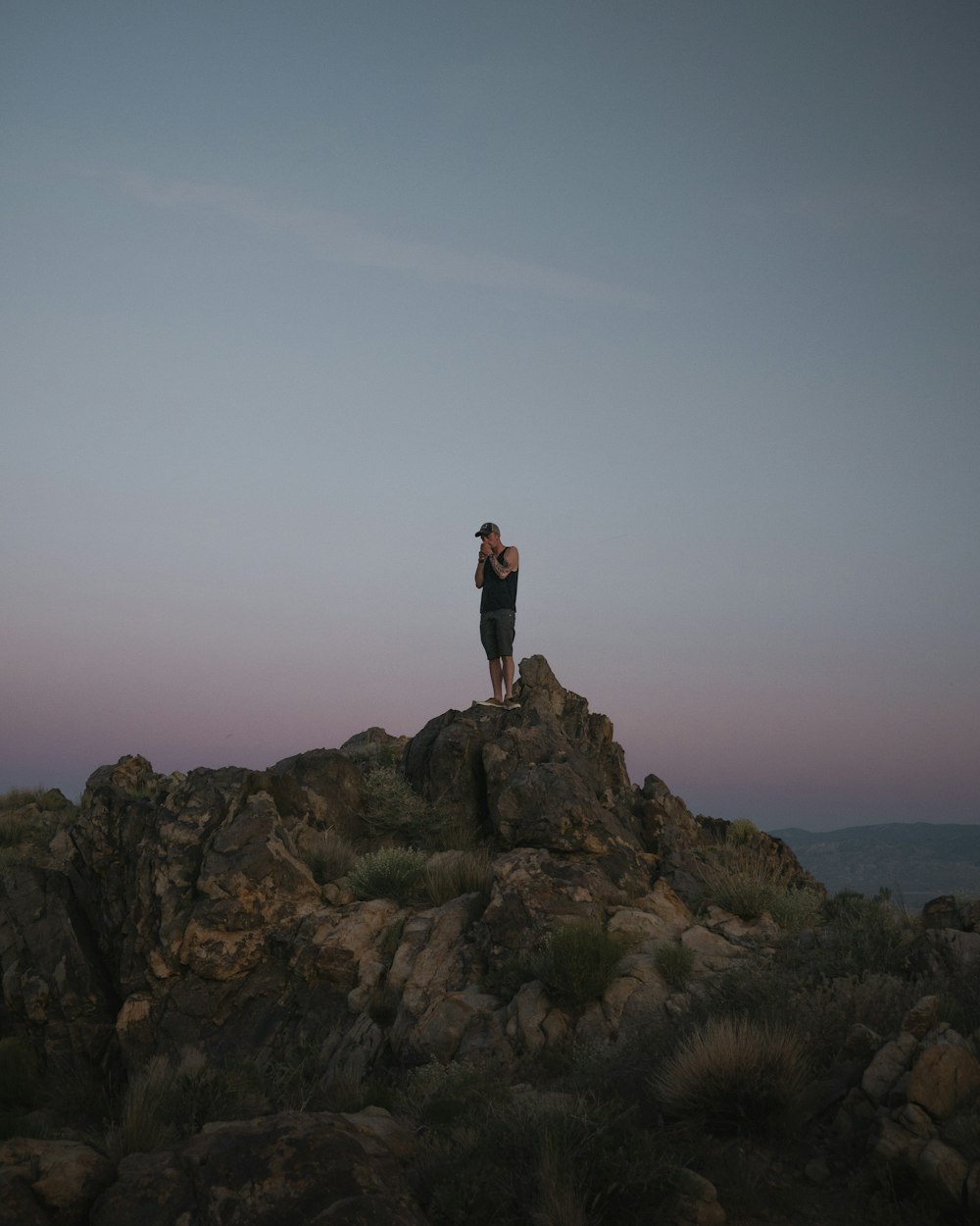 man standing on rock