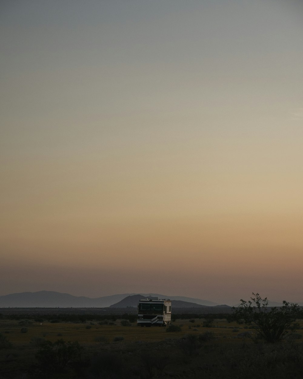 white bus on rough road