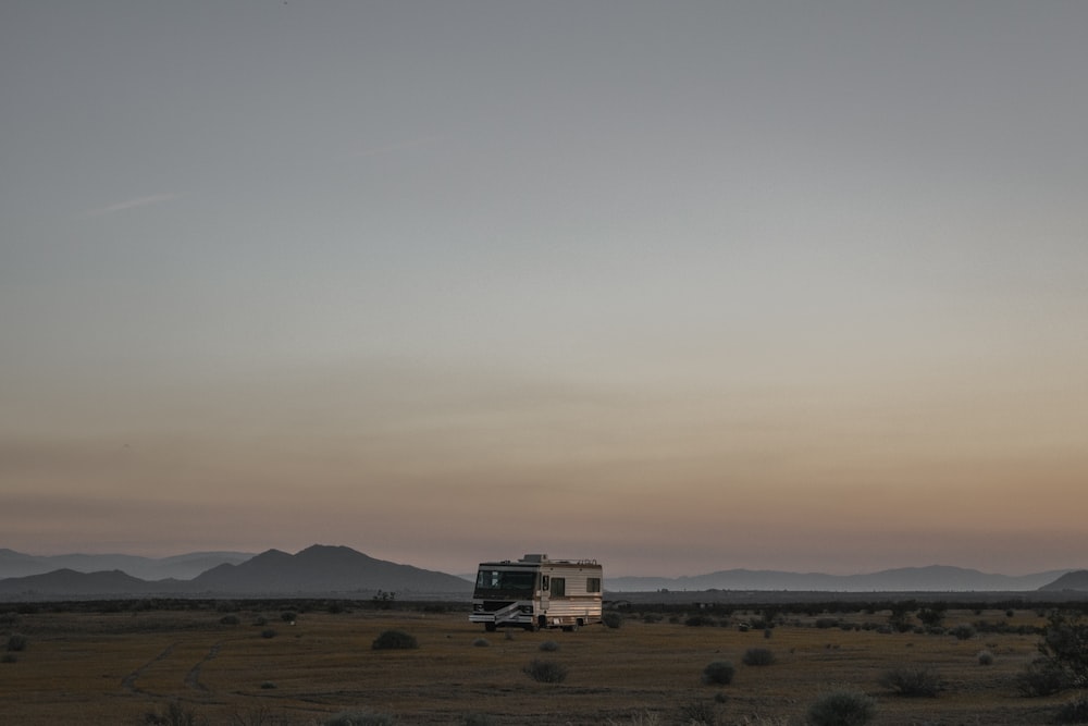 gray RV trailer on desert scenery