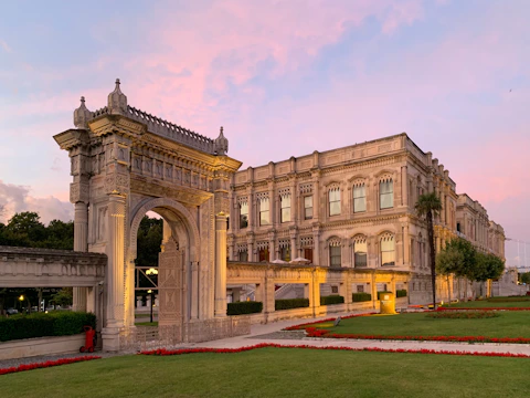 A clean and well-maintained government building exterior at sunset
