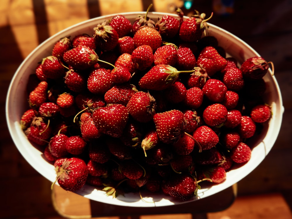 strawberry fruits in white bowl