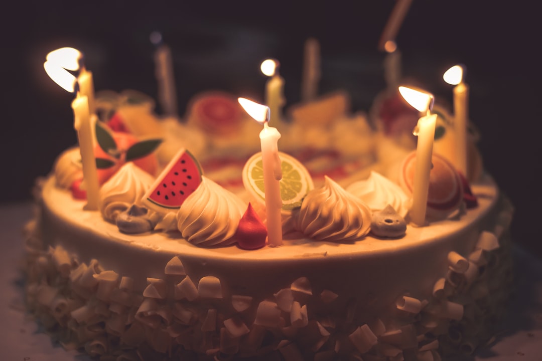 round lighted cake with strawberry