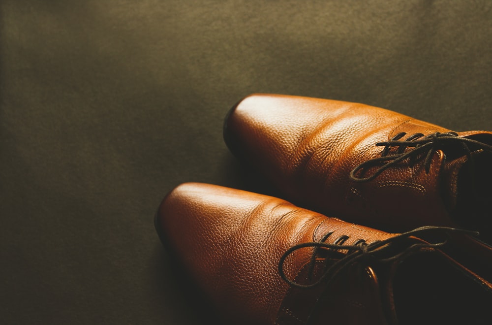 pair of brown leather dress shoes