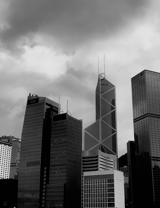 grey clouds over city buildings in Victoria Harbour Hong Kong