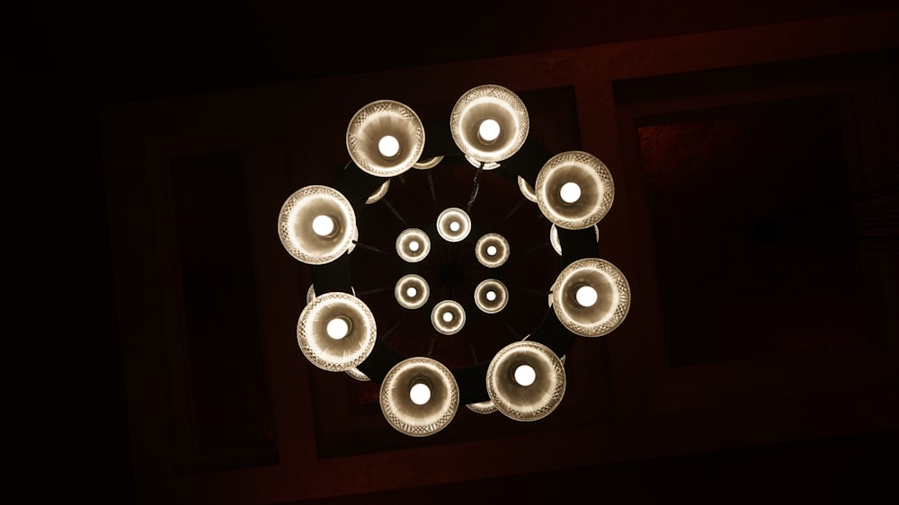 an overhead view of a chandelier in a dark room