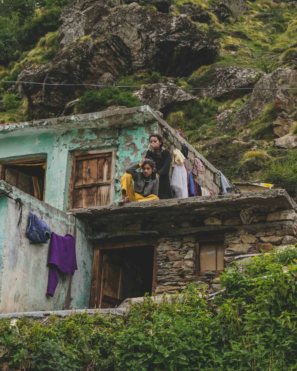 two women on concrete roof