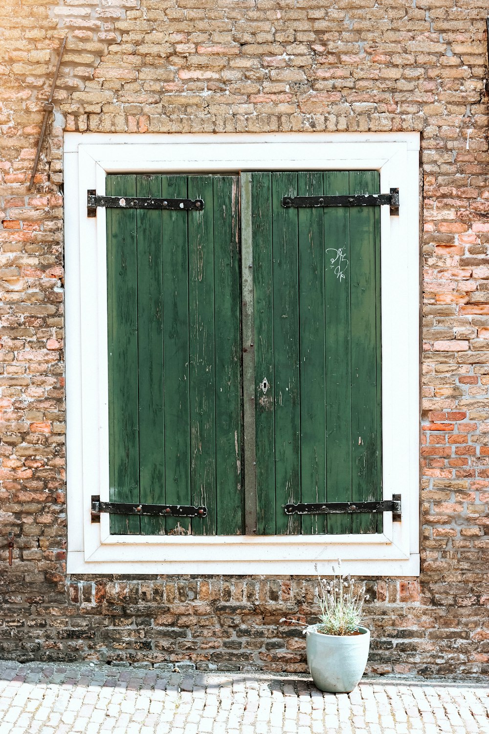 green and white wooden window