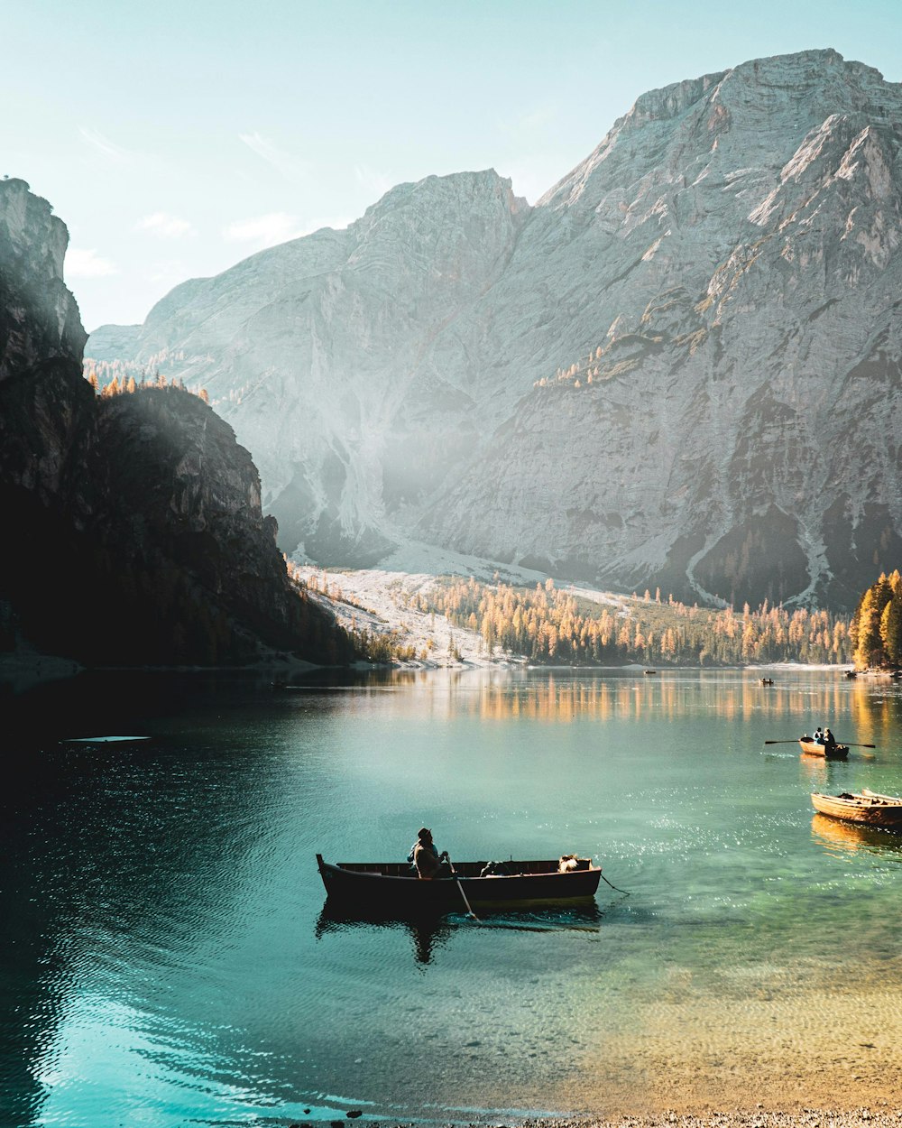 person on brown canoe