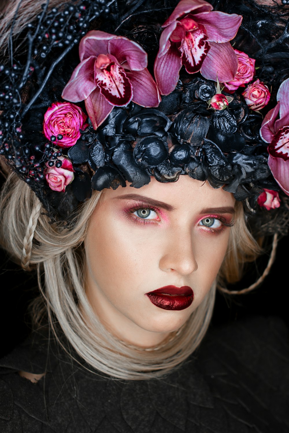 woman wearing black and purple flower headdress