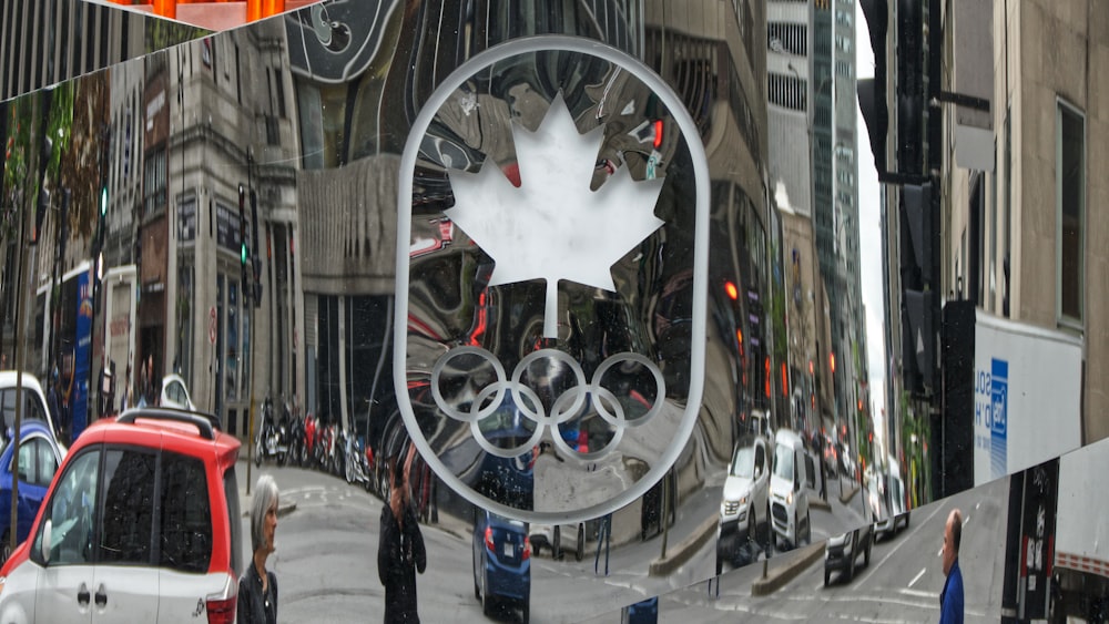 a reflection of a canadian flag on a building