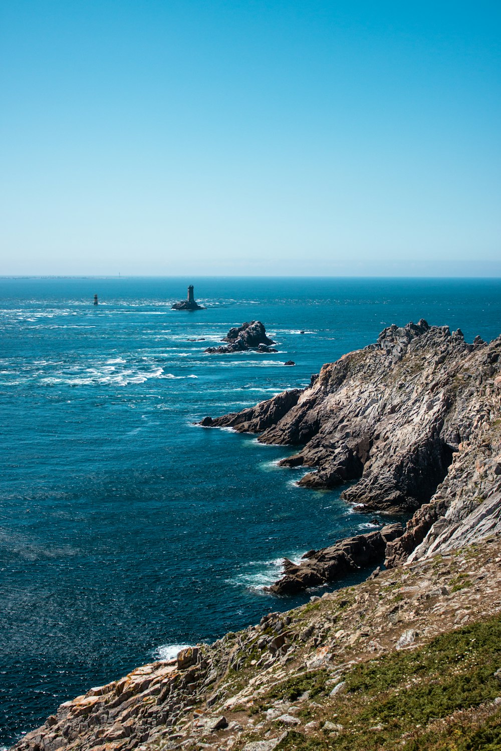 gray cliff and body of water