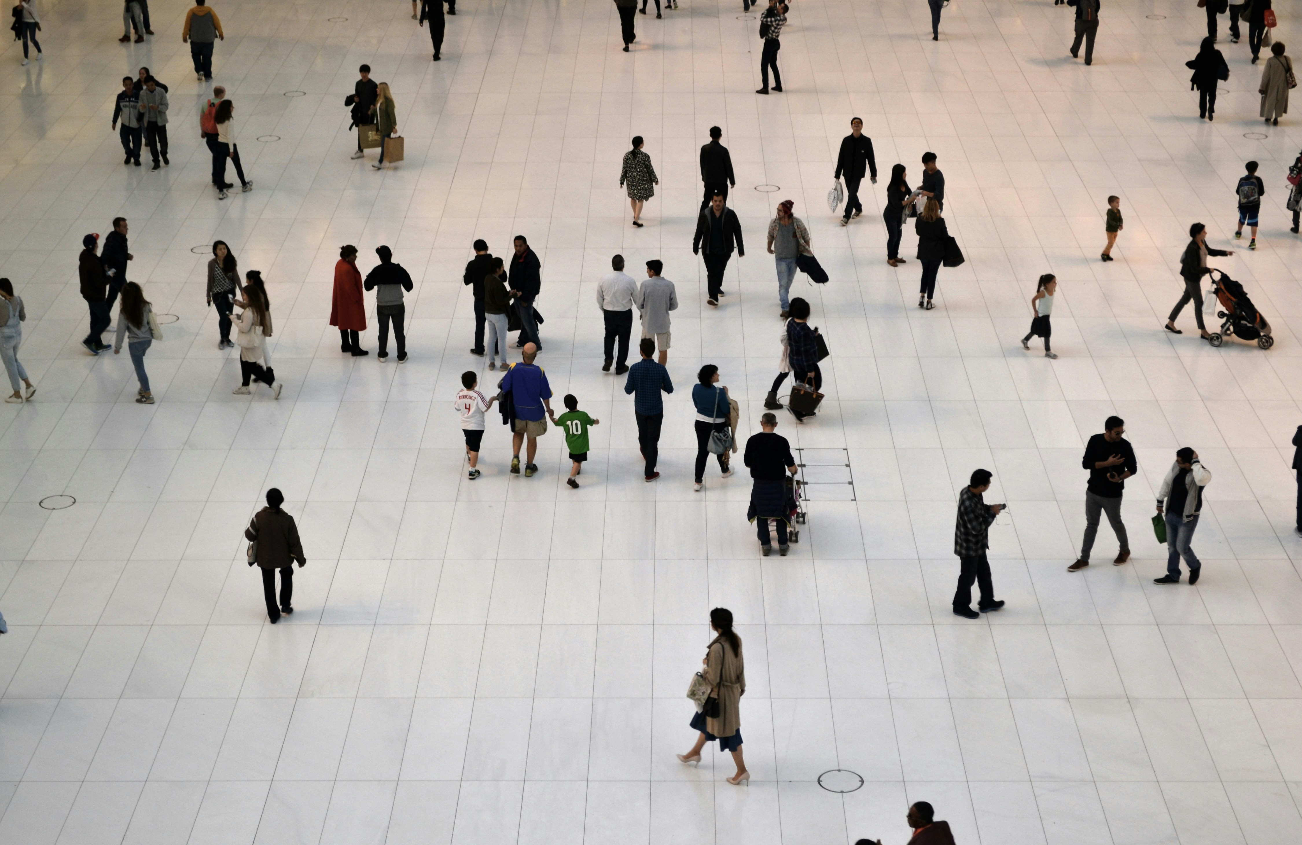 people standing on white floor tiles