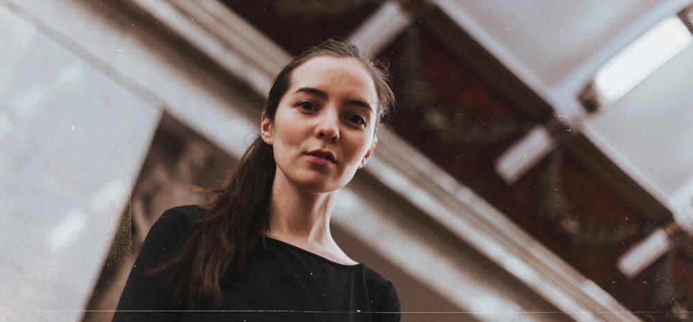 women's black crew-neck top close-up photography