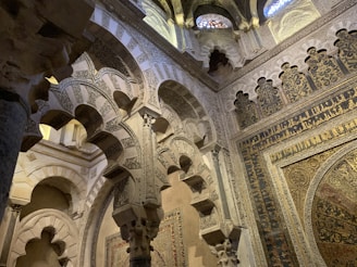 The majestic arches and delicate arabesques inside the mosque-cathedral of Córdoba, blending faiths in stone.