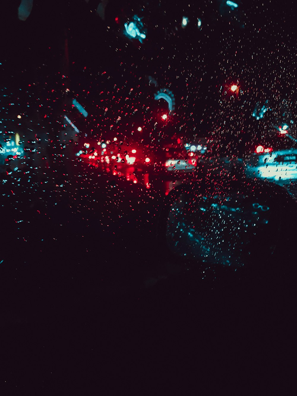 red car taillights lit up during traffic at nighttime