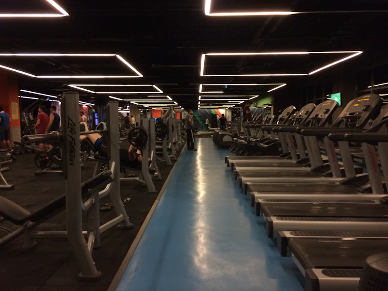 A vibrant gym scene with people of all ages working out together, showcasing strength and camaraderie.