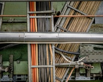 a close up of pipes and wires in a building